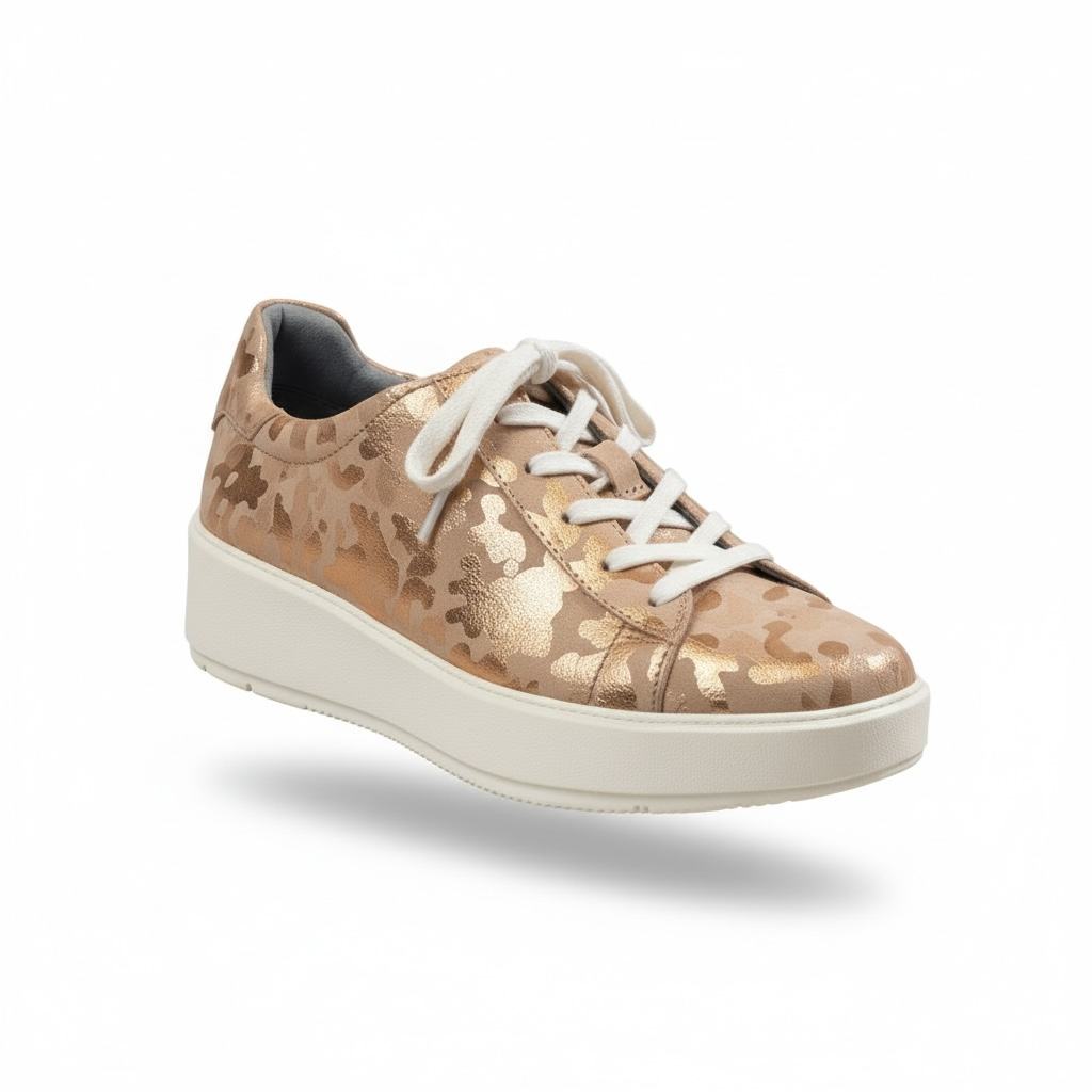 Rose gold platform sneakers by Clarks